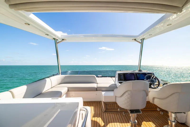 Dreams Yacht Photos Pics Sunseeker Manhattan 55 yacht interior, 2021 model, featuring luxurious seating and ocean view.