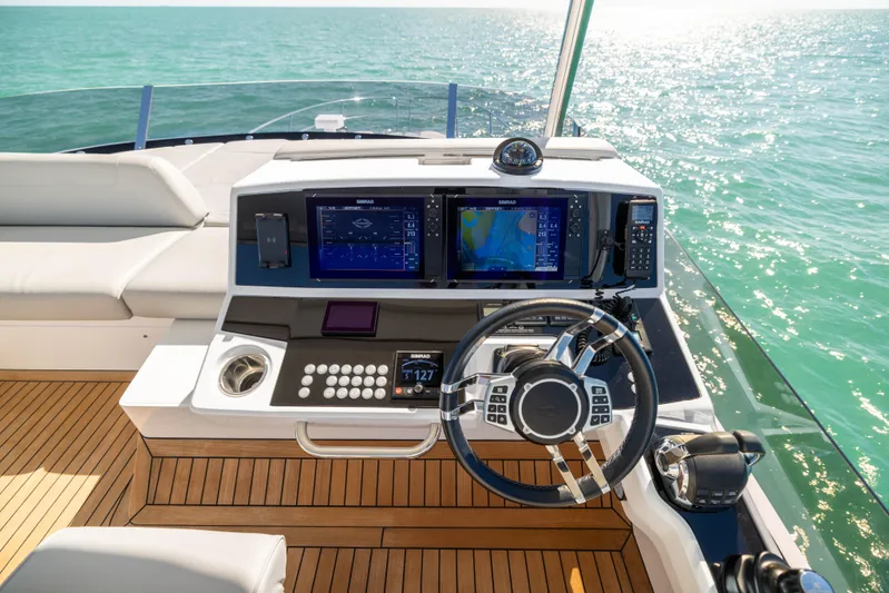 Dreams Yacht Photos Pics Sunseeker Manhattan 55 yacht helm with modern navigation systems, 2021 model, on open sea.