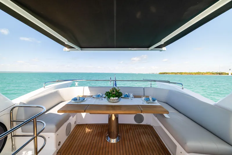 Dreams Yacht Photos Pics Luxurious 2021 Sunseeker Manhattan 55 yacht with elegant outdoor dining area and ocean view.