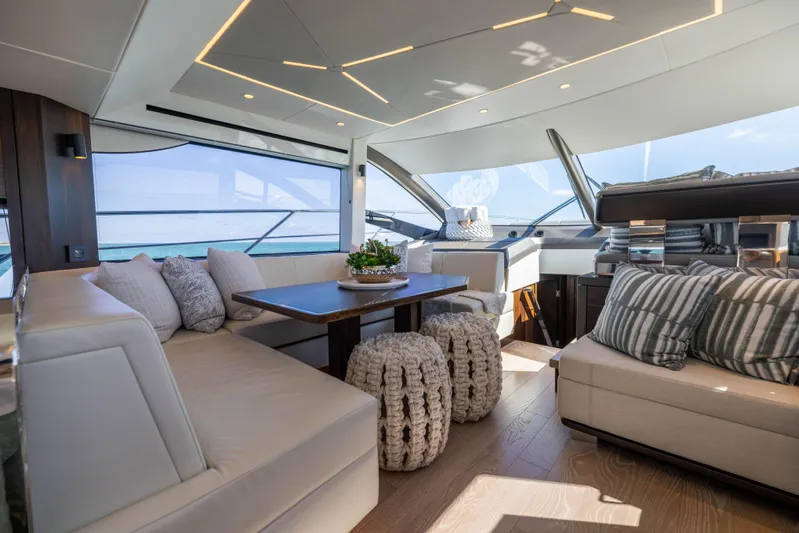 Dreams Yacht Photos Pics Luxurious interior of 2021 Sunseeker Manhattan 55 yacht with elegant seating and modern design.