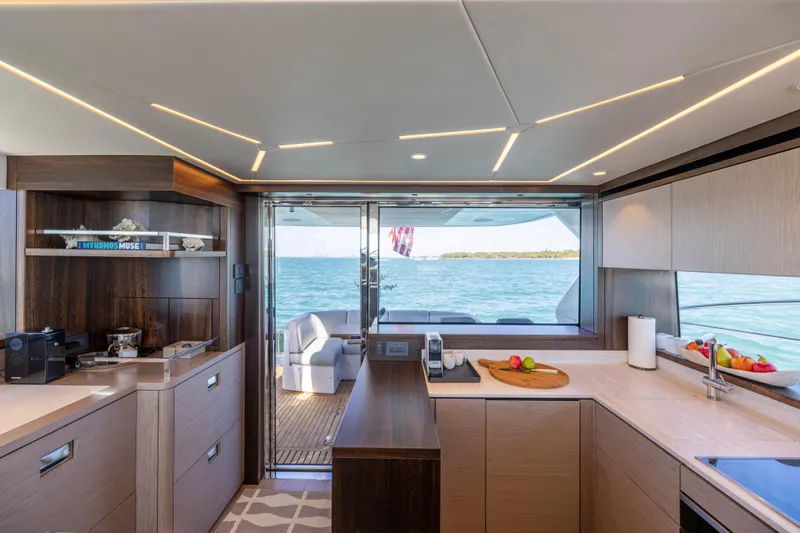 Dreams Yacht Photos Pics Luxurious interior of 2021 Sunseeker Manhattan 55 yacht with modern kitchen and ocean view.