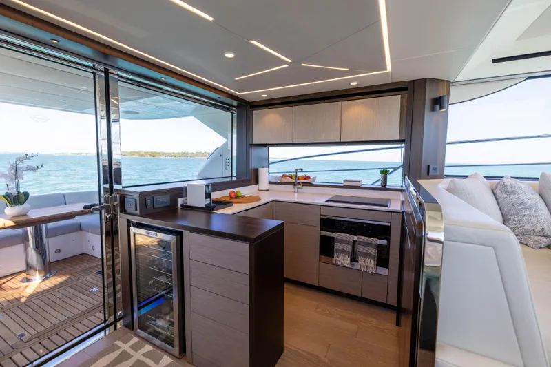 Dreams Yacht Photos Pics Luxurious interior of 2021 Sunseeker Manhattan 55 yacht with modern kitchen and ocean view.