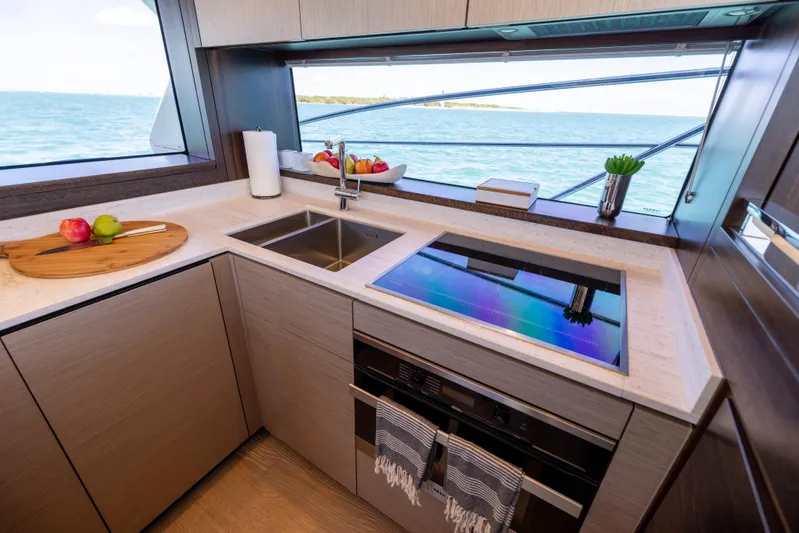 Dreams Yacht Photos Pics Modern kitchen interior on 2021 Sunseeker Manhattan 55 yacht with ocean view.