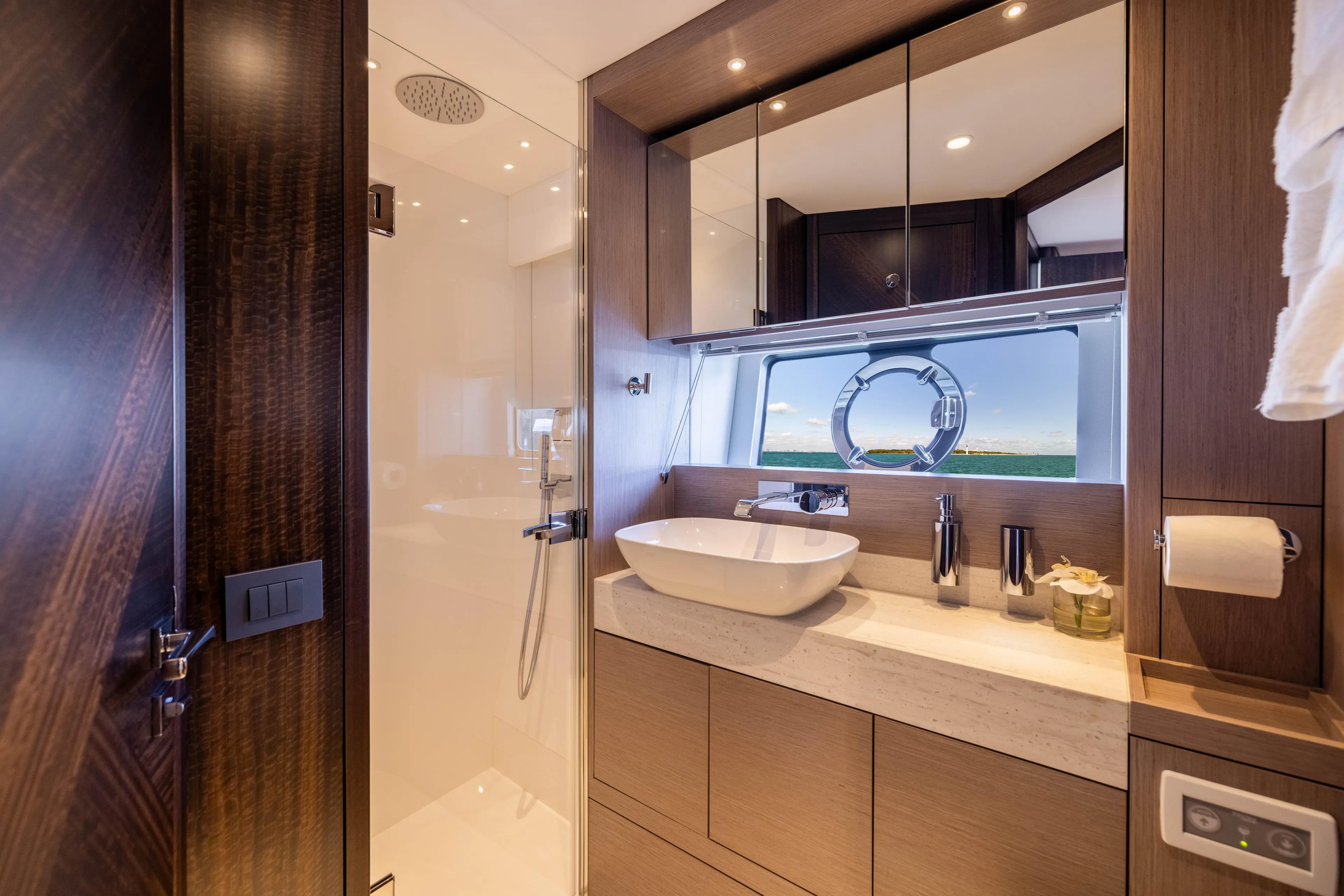 Dreams Yacht Photos Pics Luxurious bathroom interior of 2021 Sunseeker Manhattan 55 yacht with modern fixtures.