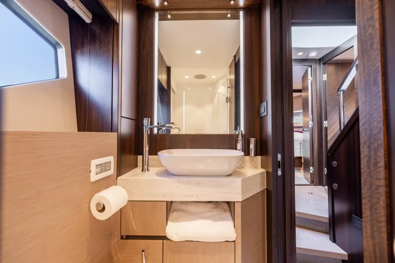 Dreams Yacht Photos Pics Luxurious bathroom interior of 2021 Sunseeker Manhattan 55 yacht, featuring modern sink and elegant design.