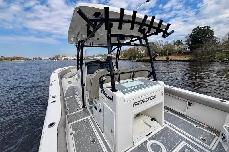  Yacht Photos Pics 2023 Sea Fox 328 Commander boat on water, featuring sleek design and spacious deck.