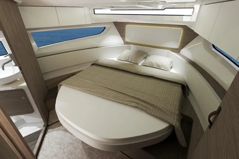  Yacht Photos Pics Manufacturer Provided Image: Luxurious interior cabin of 2026 Jeanneau NC 1095 Coupe Series 2 yacht.