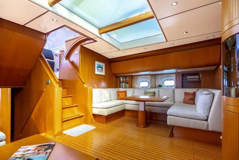 La Joie De Mer Yacht Photos Pics Luxurious interior of 2005 Jongert 2900M yacht with wooden finishes and skylight.