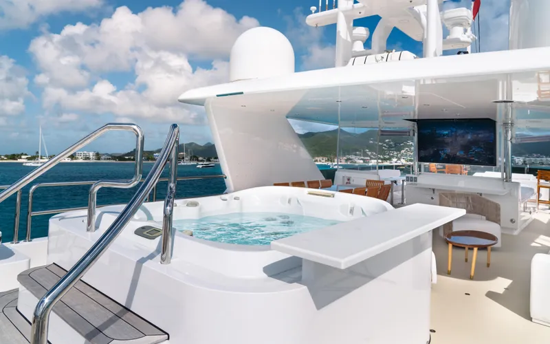 Sea Class Yacht Photos Pics Luxurious 1997 Christensen yacht deck with jacuzzi, ocean view, and clear skies.