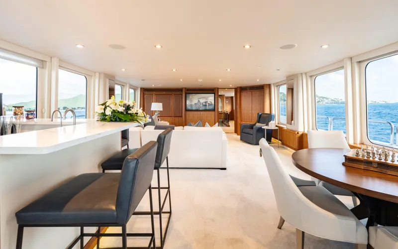 Sea Class Yacht Photos Pics Luxurious interior of a 1997 Christensen yacht with elegant seating and ocean views.