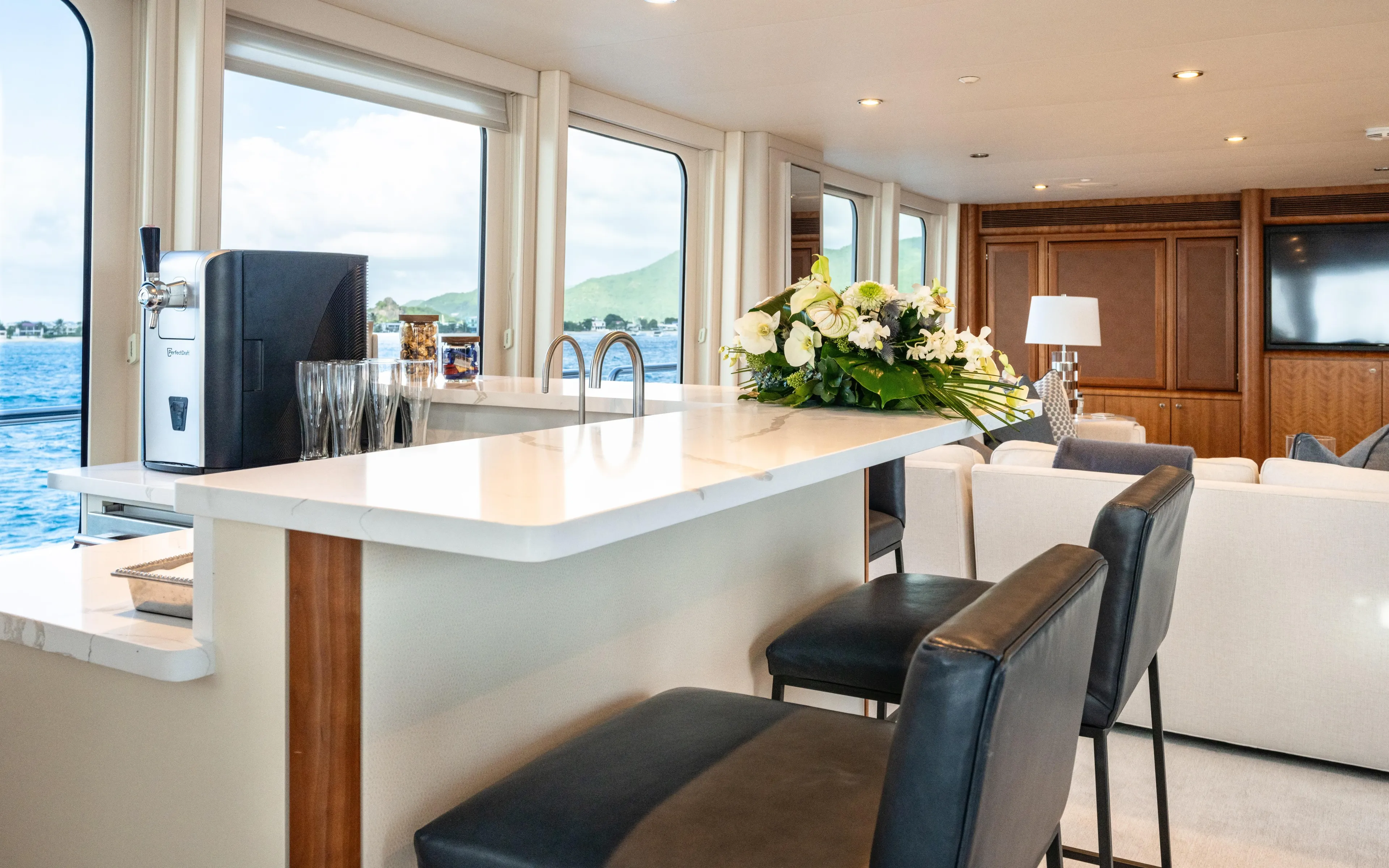 Sea Class Yacht Photos Pics Luxurious yacht interior with bar, flowers, and ocean view; Christensen 1997 model.