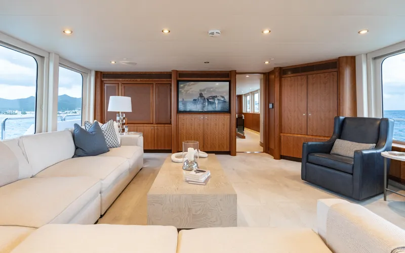 Sea Class Yacht Photos Pics Luxurious yacht interior with elegant seating, wooden accents, and ocean views, Christensen 1997 model.