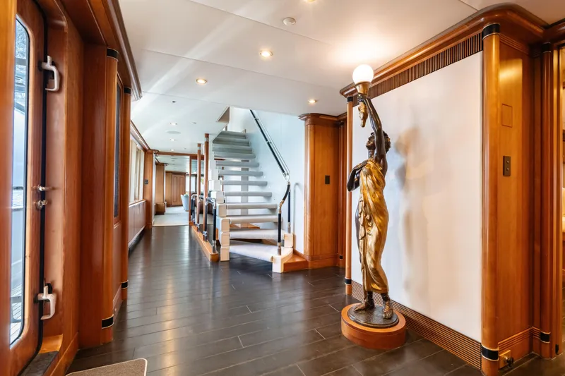 Sea Class Yacht Photos Pics Luxurious yacht interior with elegant staircase and decorative statue, Christensen 1997 model.