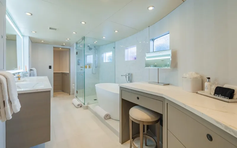 Sea Class Yacht Photos Pics Luxurious yacht bathroom with modern fixtures, glass shower, and elegant vanity, Christensen 1997 model.