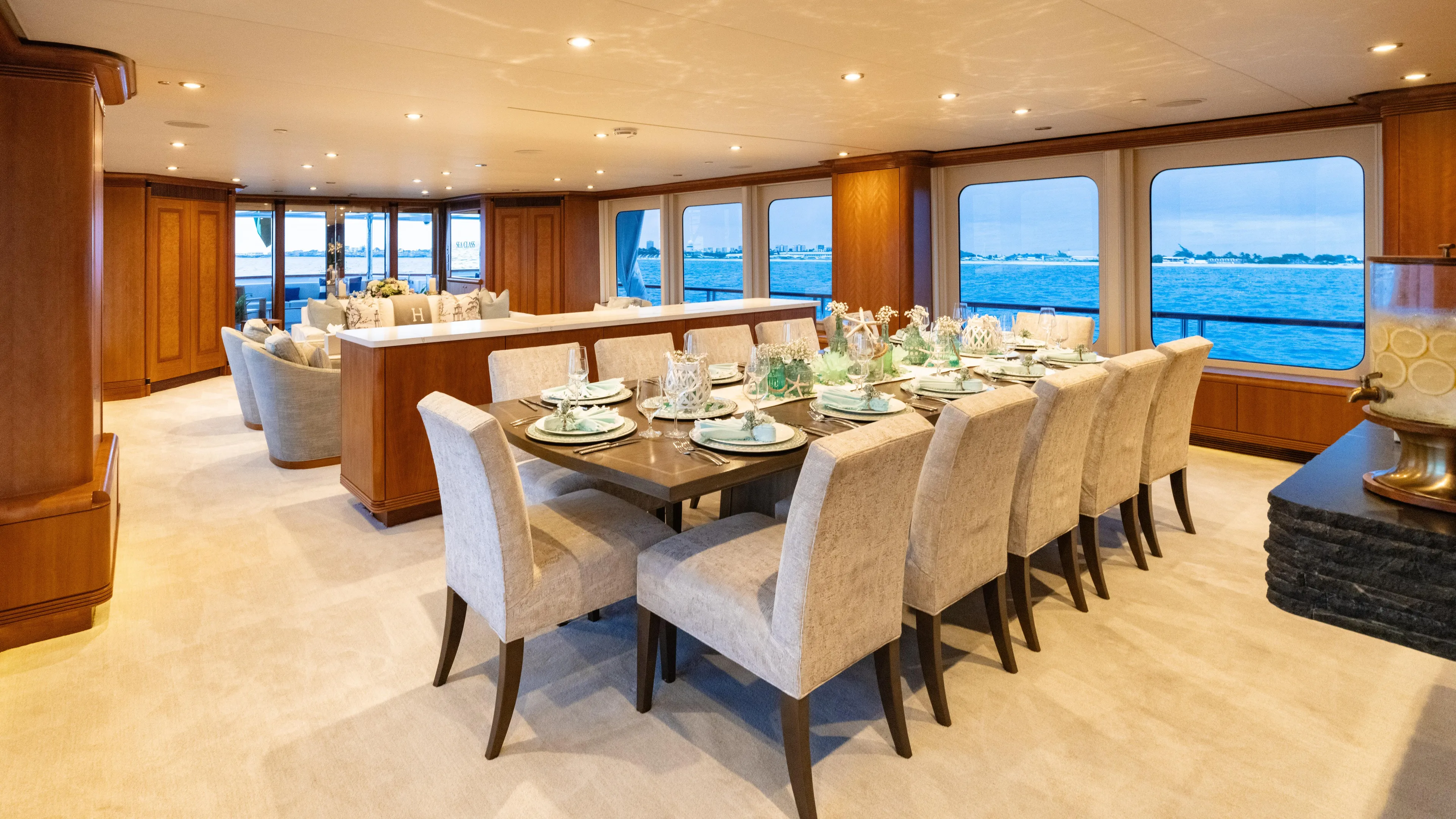 Sea Class Yacht Photos Pics Luxurious dining area on 1997 Christensen yacht with elegant table setting and ocean view.