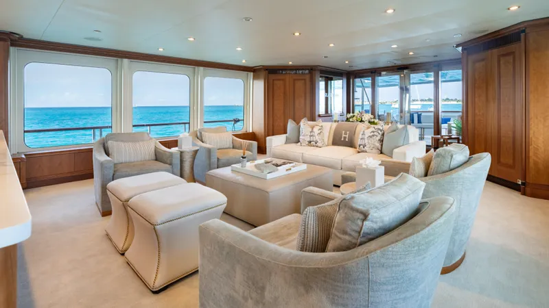 Sea Class Yacht Photos Pics Luxurious yacht interior with elegant seating, ocean view, and wooden accents, Christensen 1997 model.