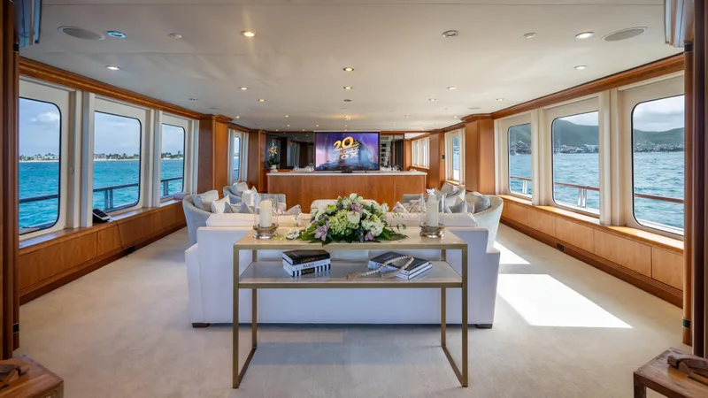 Sea Class Yacht Photos Pics Luxurious yacht interior with elegant seating, large windows, and ocean view, Christensen 1997 model.