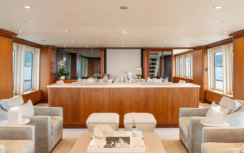 Sea Class Yacht Photos Pics Luxurious yacht interior with elegant seating and wooden accents, Christensen 1997 model.