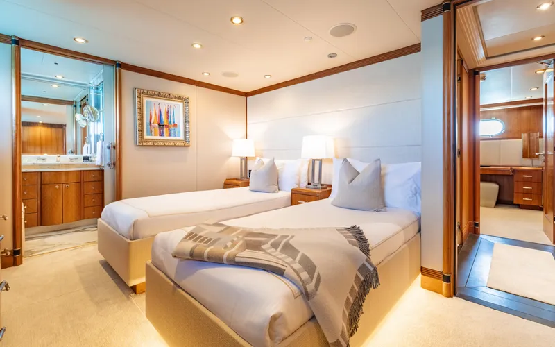Sea Class Yacht Photos Pics Luxurious twin bedroom on a 1997 Christensen yacht, featuring elegant decor and ensuite bathroom.