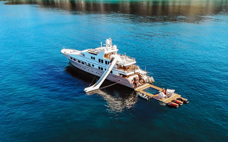 Sea Class Yacht Photos Pics Luxurious 1997 Christensen yacht with slide and pool on serene blue waters.