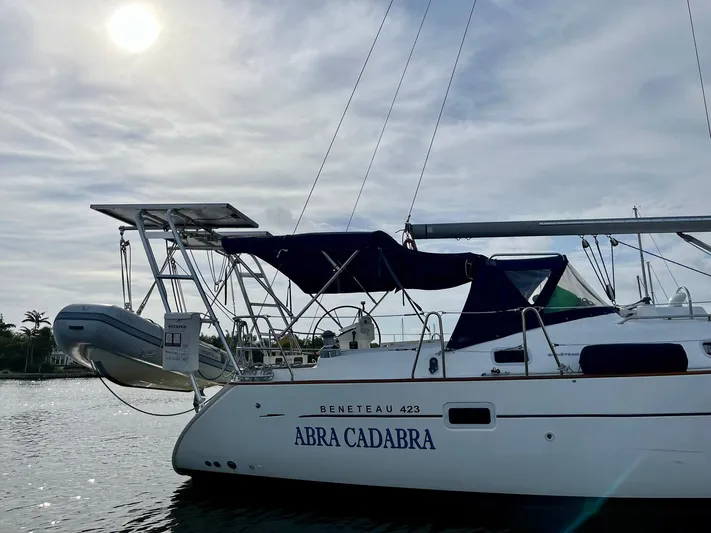 Abra Cadabra Yacht Photos Pics 2004 Beneteau Oceanis 423 sailboat named "Abra Cadabra" docked under a cloudy sky.