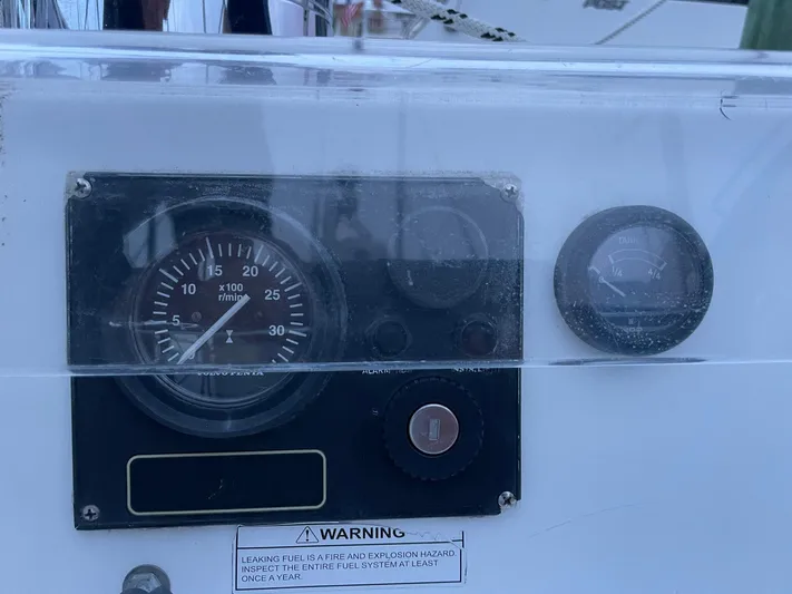 Abra Cadabra Yacht Photos Pics Control panel of a 2004 Beneteau Oceanis 423 sailboat, featuring gauges and warning label.