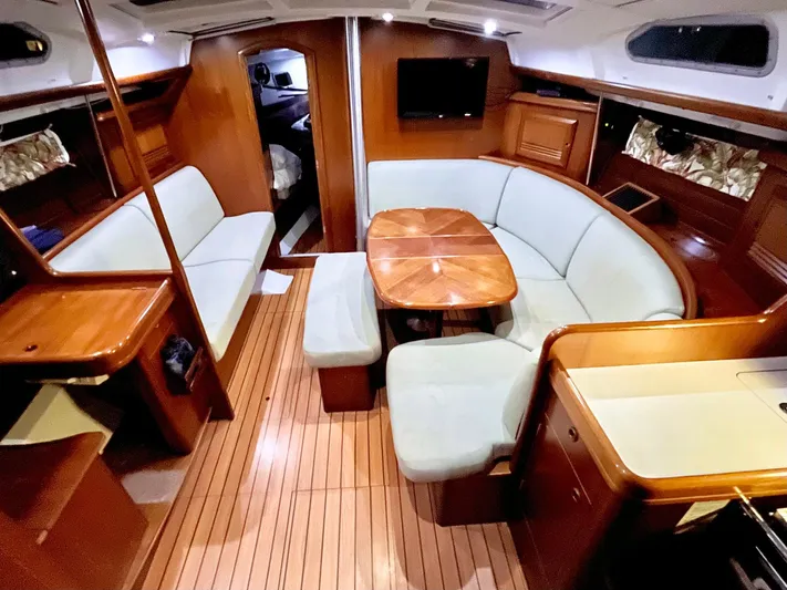 Abra Cadabra Yacht Photos Pics Interior of 2004 Beneteau Oceanis 423 yacht with elegant wood finish and cozy seating.