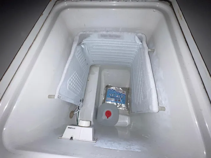 Abra Cadabra Yacht Photos Pics Freezer compartment of 2004 Beneteau Oceanis 423 sailboat, partially filled with ice.