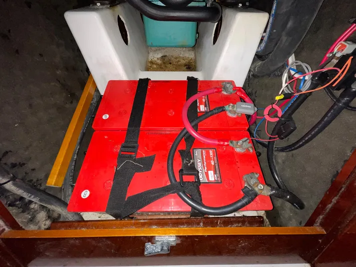 Abra Cadabra Yacht Photos Pics Battery compartment of a 2004 Beneteau Oceanis 423 sailboat with red Odyssey batteries.