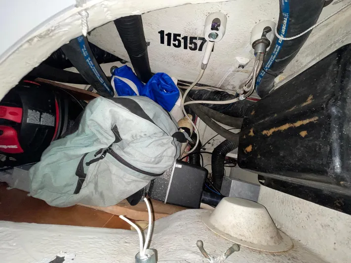 Abra Cadabra Yacht Photos Pics 2004 Beneteau Oceanis 423 interior storage area with equipment and bags.