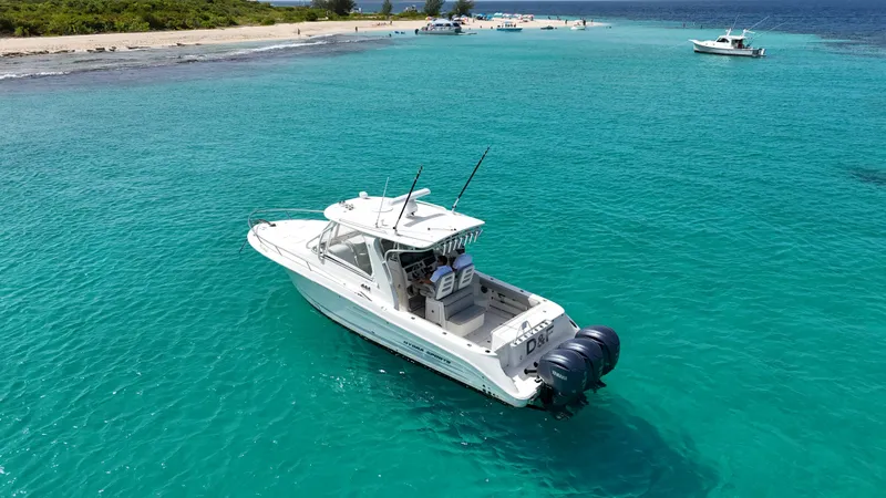  Yacht Photos Pics 2009 Hydra-Sports 3500 VX boat on clear turquoise water near a sandy beach.