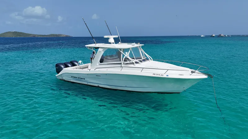  Yacht Photos Pics 2009 Hydra-Sports 3500 VX boat anchored in clear turquoise water.