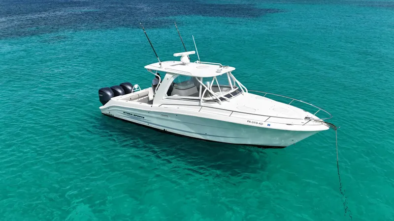  Yacht Photos Pics 2009 Hydra-Sports 3500 VX boat anchored in clear turquoise water.