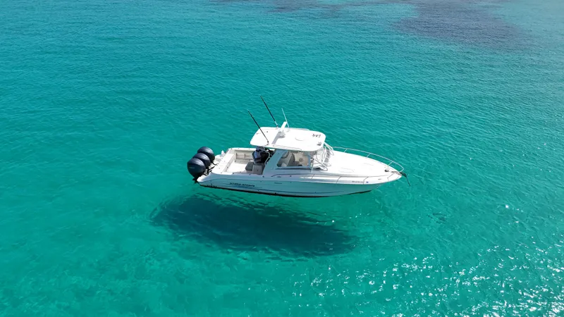  Yacht Photos Pics 2009 Hydra-Sports 3500 VX boat cruising on clear turquoise water.