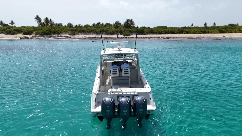  Yacht Photos Pics 2009 Hydra-Sports 3500 VX boat on turquoise water near tropical beach.