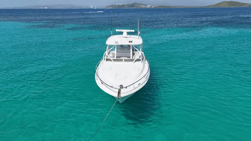  Yacht Photos Pics 2009 Hydra-Sports 3500 VX boat anchored in clear turquoise water.