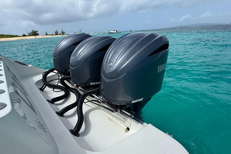  Yacht Photos Pics Triple Yamaha outboard engines on a 2009 Hydra-Sports 3500 VX in turquoise waters.