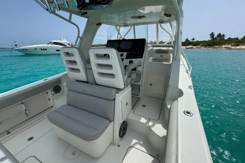  Yacht Photos Pics 2009 Hydra-Sports 3500 VX boat interior with seating, ocean view, and distant yacht.