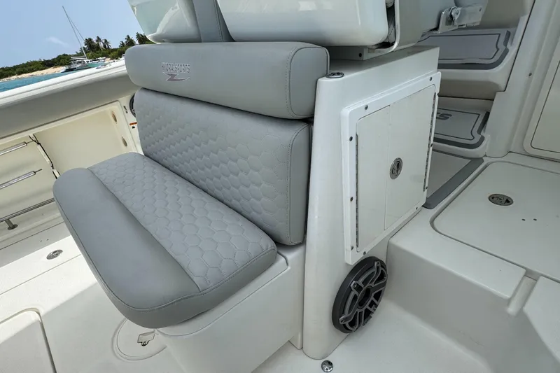  Yacht Photos Pics 2009 Hydra-Sports 3500 VX boat seating with gray upholstery and storage compartment.