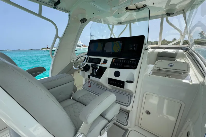  Yacht Photos Pics 2009 Hydra-Sports 3500 VX boat interior with steering wheel and navigation screens.