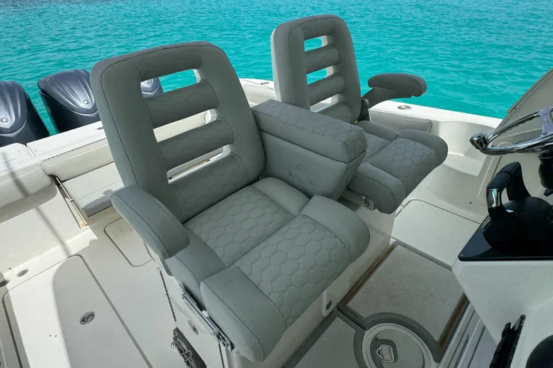  Yacht Photos Pics 2009 Hydra-Sports 3500 VX boat seats with armrests, set against turquoise water.