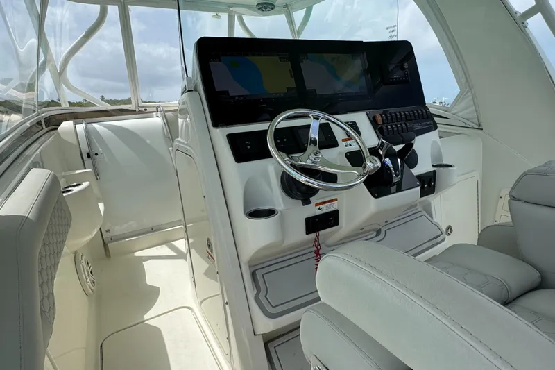  Yacht Photos Pics 2009 Hydra-Sports 3500 VX boat cockpit with steering wheel and navigation screens.