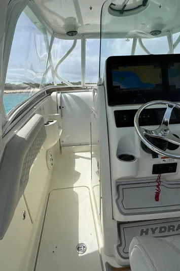  Yacht Photos Pics 2009 Hydra-Sports 3500 VX boat interior with steering wheel and navigation display.