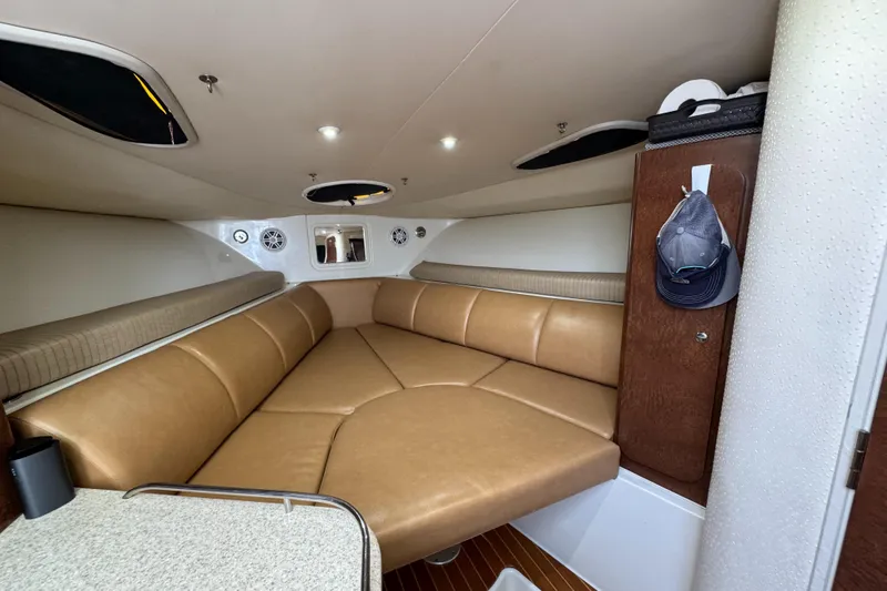  Yacht Photos Pics 2009 Hydra-Sports 3500 VX cabin interior with tan leather seating and wood accents.