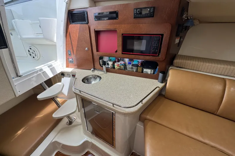  Yacht Photos Pics 2009 Hydra-Sports 3500 VX cabin interior with kitchenette, sink, and seating area.