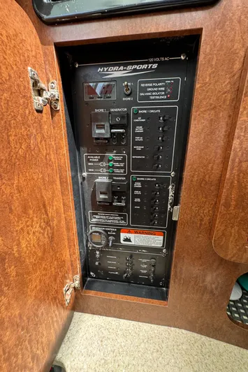  Yacht Photos Pics Electrical panel of a 2009 Hydra-Sports 3500 VX boat, showing switches and controls.