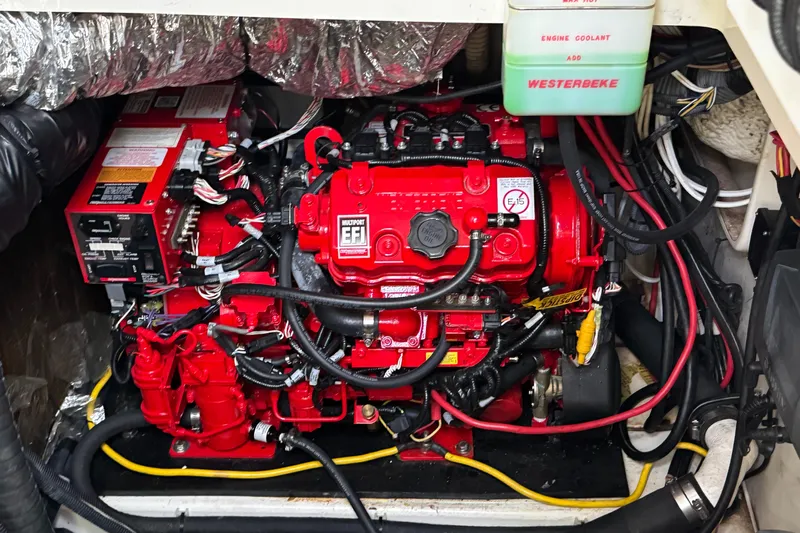  Yacht Photos Pics Engine compartment of a 2009 Hydra-Sports 3500 VX boat, featuring a red Westerbeke engine.