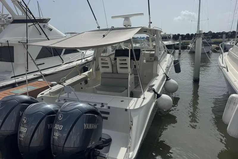  Yacht Photos Pics 2009 Hydra-Sports 3500 VX boat docked with Yamaha engines, shaded seating area.