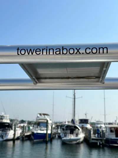 "orion" Yacht Photos Pics Hunter 45 Deck Salon 2012 sailboat with marina view and "towerinabox.com" branding.