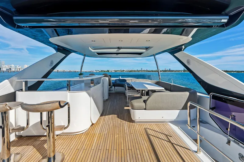  Yacht Photos Pics Luxurious 2021 Azimut Fly 78 yacht deck with modern seating and ocean view.